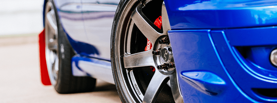 wheel alignment service on a blue car